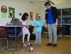 Two Girls Working with Robot