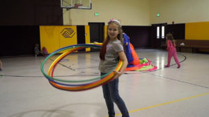 Kid at BGC Having Fun with Hula Hoops